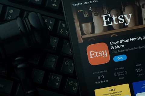 Dhaka, Bangladesh- 28 Oct 2025: An iPad displaying the Etsy app against a judge's gavel and dark