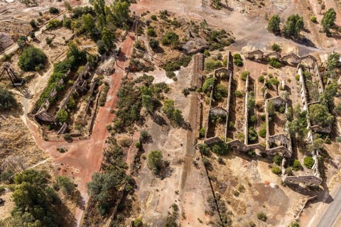 Ruins of former workshop halls, Mina de Sao Domingos, historic copper open-pit mine, aerial view,