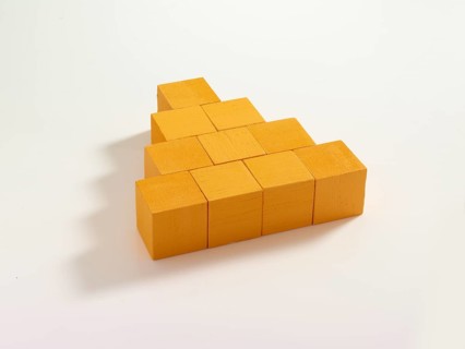10 yellow wooden cubes against a white background