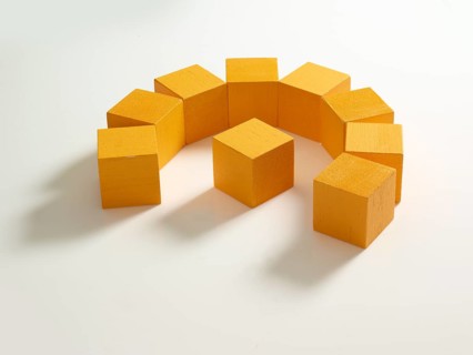 9 yellow wooden cubes against a white background