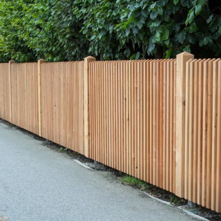 Wooden fence on the side of the road, vertical slats, town of Tegernsee, Upper Bavaria, Bavaria,