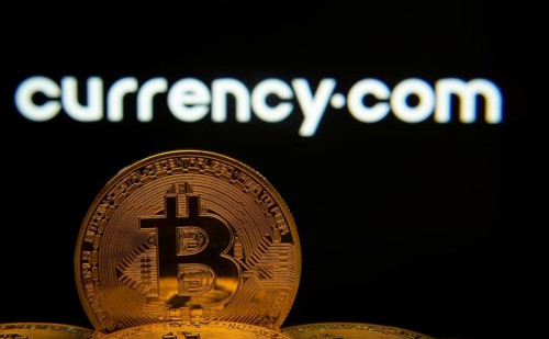 Dhaka, Bangladesh- 22 June 2025: Close-up of Bitcoin coins with the Currency.com logo visible on a