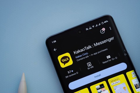 Dhaka, Bangladesh- 29 May 2025: On a blue surface, a smartphone displays the KakaoTalk app within