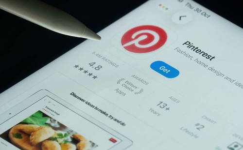 Dhaka, Bangladesh- 30 Oct 2025: Pinterest app on a iPad screen with a pen pointing at the install