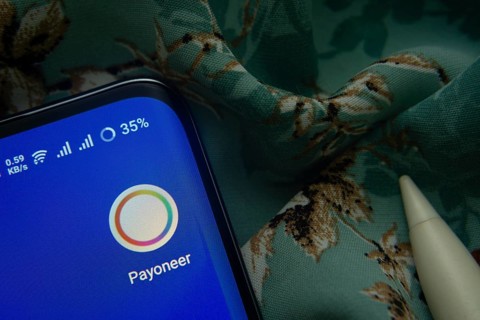 Dhaka, Bangladesh- 07 May 2025: Payoneer app icon is seen on smartphone
