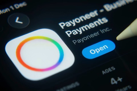 Dhaka, Bangladesh- 01 Dec 2025: A close-up of the Payoneer app icon in the App Store on an iPad