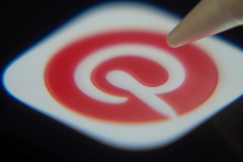 Dhaka, Bangladesh- 06 Dec 2025: Close-up of the Pinterest app on a screen with a stylus pointing at