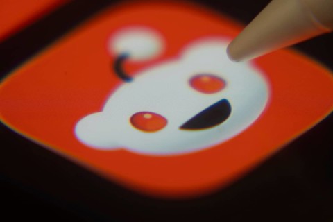 Dhaka, Bangladesh- 06 Dec 2025: Close-up of the Reddit app on a screen with a stylus pointing at it