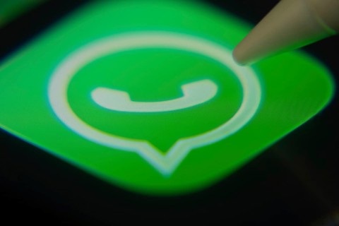 Dhaka, Bangladesh- 06 Dec 2025: Close-up of the WhatsApp app on a screen with a stylus pointing at