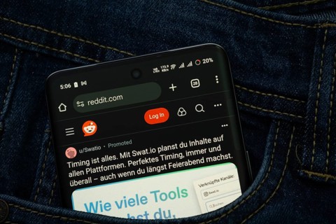 Dhaka, Bangladesh- 15 June 2025: A smartphone displaying the Reddit web interface peeks out of a