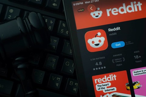 Dhaka, Bangladesh- 28 Oct 2025: An iPad displaying the Reddit app against a judge's gavel and dark