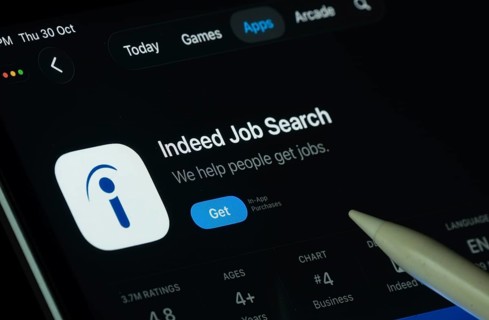 Dhaka, Bangladesh- 30 Oct 2025: Indeed app displayed on a iPad screen in dark mode with a digital