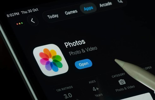 Dhaka, Bangladesh- 30 Oct 2025: Apple Photos app displayed on a iPad screen in dark mode with a