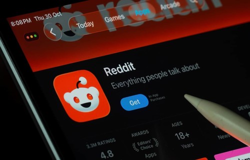 Dhaka, Bangladesh- 30 Oct 2025: Reddit app displayed on a iPad screen in dark mode with a digital