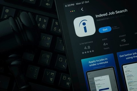 Dhaka, Bangladesh- 28 Oct 2025: An iPad displaying the Indeed app against a judge's gavel and dark