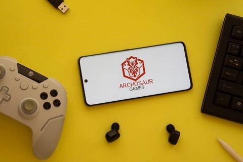 Dhaka, Bangladesh- 23 March 2025: Archosaur Games logo displayed on a smartphone surrounded by