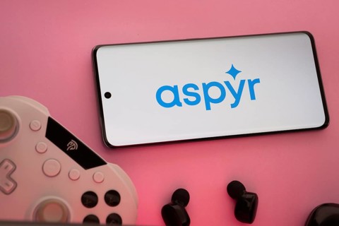 Dhaka, Bangladesh- 08 Apr 2025: A smartphone displaying the Aspyr logo next to a gaming controller