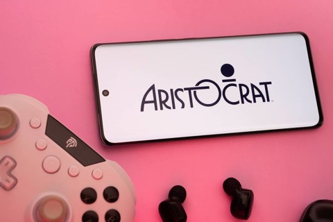 Dhaka, Bangladesh- 08 Apr 2025: A smartphone displaying the Aristocrat logo next to a gaming