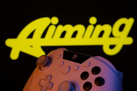 Dhaka, Bangladesh- 20 Mar 2025: A close-up of a gamepad with the Aiming Inc seen on screen in the