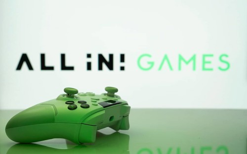 Dhaka, Bangladesh- 20 Mar 2025: A close-up of a white gamepad with the All in! Games seen on screen