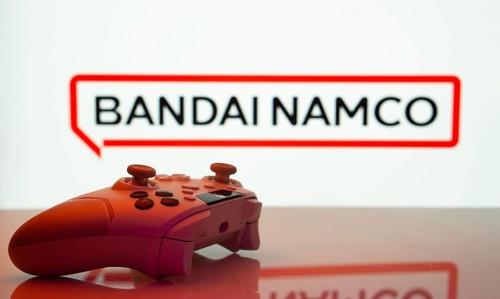 Dhaka, Bangladesh- 20 Mar 2025: A close-up of a white gamepad with the Bandai Namco seen on screen