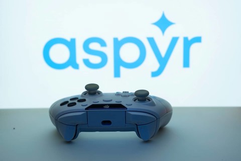 Dhaka, Bangladesh- 08 Apr 2025: A gaming controller in front of a Aspyr screen