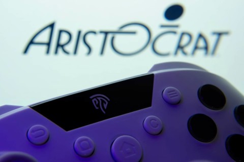 Dhaka, Bangladesh- 24 Mar 2025: A close-up of a gamepad with the Aristocrat seen on screen in the