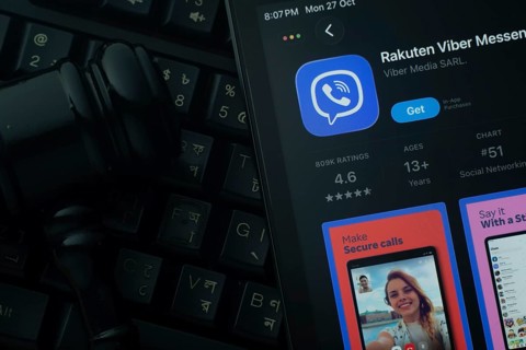 Dhaka, Bangladesh- 28 Oct 2025: An iPad displaying the Rakuten Viber app against a judge's gavel