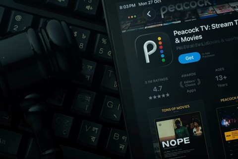 Dhaka, Bangladesh- 28 Oct 2025: An iPad displaying the Peacock TV app against a judge's gavel and