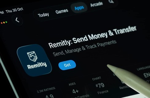 Dhaka, Bangladesh- 30 Oct 2025: Remitly app displayed on a iPad screen in dark mode with a digital
