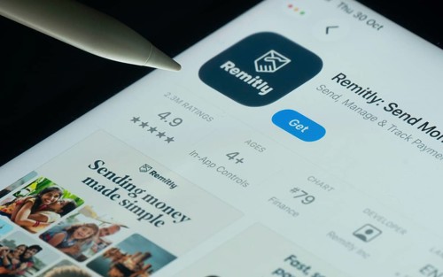 Dhaka, Bangladesh- 30 Oct 2025: Remitly app on a iPad screen with a pen pointing at the install