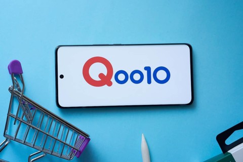 Dhaka, Bangladesh- 03 July 2025: Smartphone displaying Qoo10 logo with shopping cart on a blue