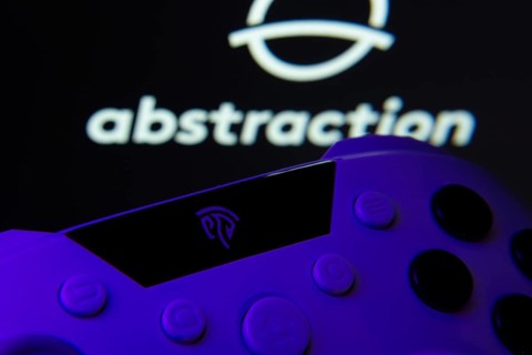 Dhaka, Bangladesh- 24 Mar 2025: A close-up of a gamepad with the Abstraction seen on screen in the