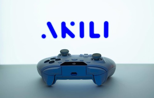 Dhaka, Bangladesh- 08 Apr 2025: A gaming controller in front of a Akili Interactive screen