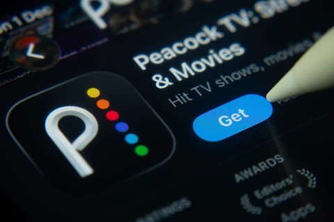 Dhaka, Bangladesh- 01 Dec 2025: A close-up of the Peacock TV app icon in the App Store on an iPad