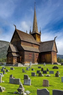 Lom Stave Church (Lom stavkyrkje) with cemetery in the foreground, Lom, Norway