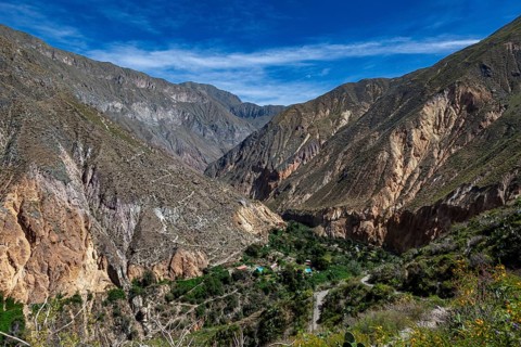 Mountainous landscape under clear skies with a deeply cut gorge, The landscape of Colca Canyon in