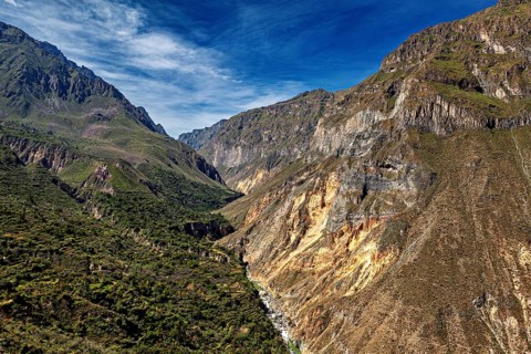 Mountain landscape with deep gorges under bright blue sky, The landscape of Colca Canyon in the
