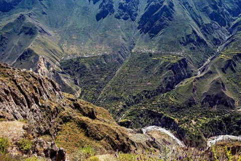 Lush valley with agricultural terraces nestled in a mountainous environment, the landscape of the