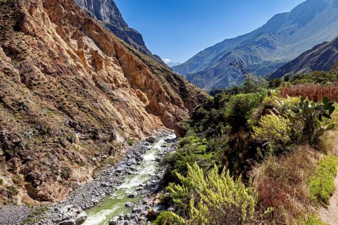 View of a river flowing through a rocky gorge between steep mountains, The landscape of Colca