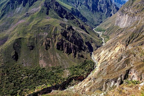 Impressive gorge in a far-reaching mountain landscape under blue skies, The landscape of Colca