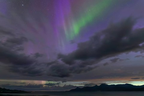 The Vestfjord in Nordland, Norway, has an enchanting atmosphere at night. Dark clouds and vivid