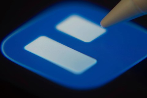 Dhaka, Bangladesh- 06 Dec 2025: Close-up of the Trello app on a screen with a stylus pointing at it