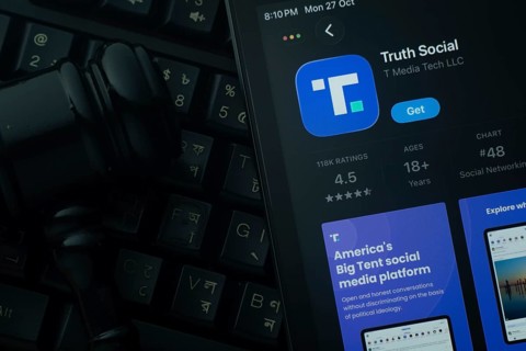 Dhaka, Bangladesh- 28 Oct 2025: An iPad displaying the Truth Social app against a judge's gavel and
