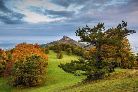 Castle and autumnal forest, Hohenzollern Castle, Hechingen, Swabian Jura, Baden-Württemberg,