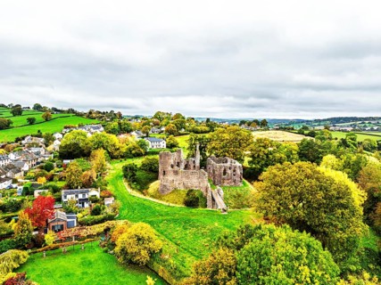 Autumn Colours over ruins of Grosmont Castle from a drone, Grosmont, Monmouthshire, Wales, UK