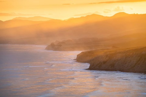 Wairarapa coast at sunset. Sea, mountains, backlight. Castlepoint, Wairarapa Coast, Wellington