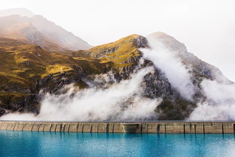 Fog rises over the dam of the Lac de Moiry Reservoir, Val d'Anniviers, Valais Alps, Canton of