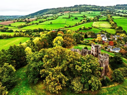 Autumn Colours over ruins of Grosmont Castle from a drone, Grosmont, Monmouthshire, Wales, UK
