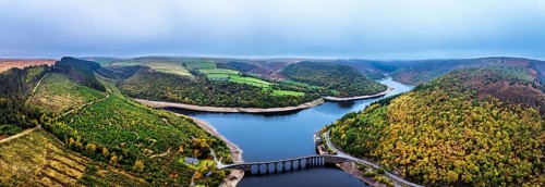 Autumn over Garreg Ddu Dam from a drone, Elan Valley, Caban-Coch Reservoir, Rhayader, Wales, UK